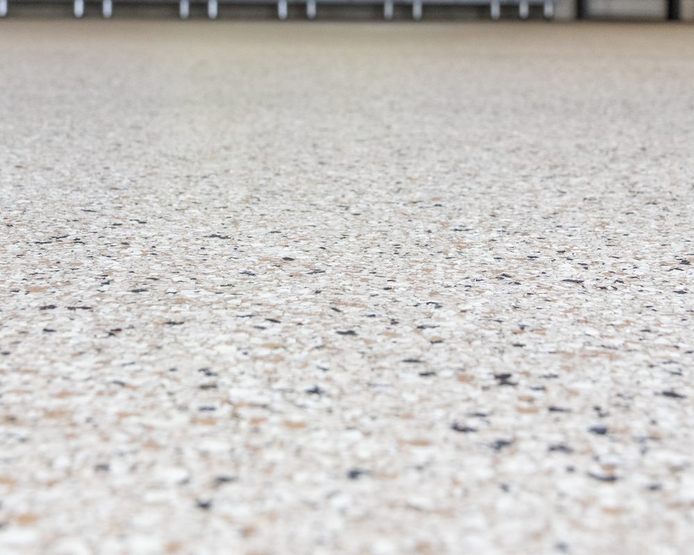 Full-broadcast chip floor in a finished garage