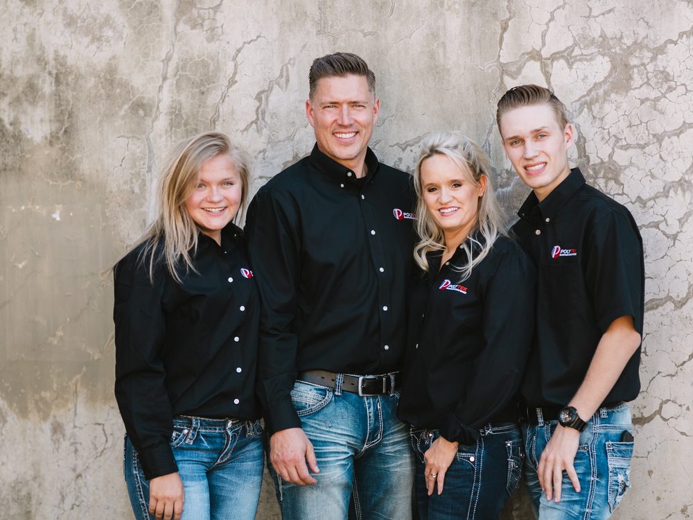 The Larson family, owners of Polytek of Redding, in black Polytek shirts